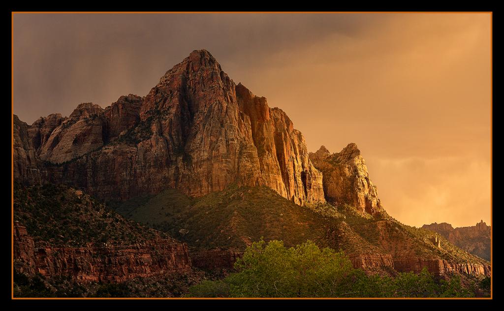 Sunset light gives way to storm clouds over the iconic Watchman.<br />By Marie Taylor-Cagara<br />Zion National Park, Utah.  USA         April 2014
