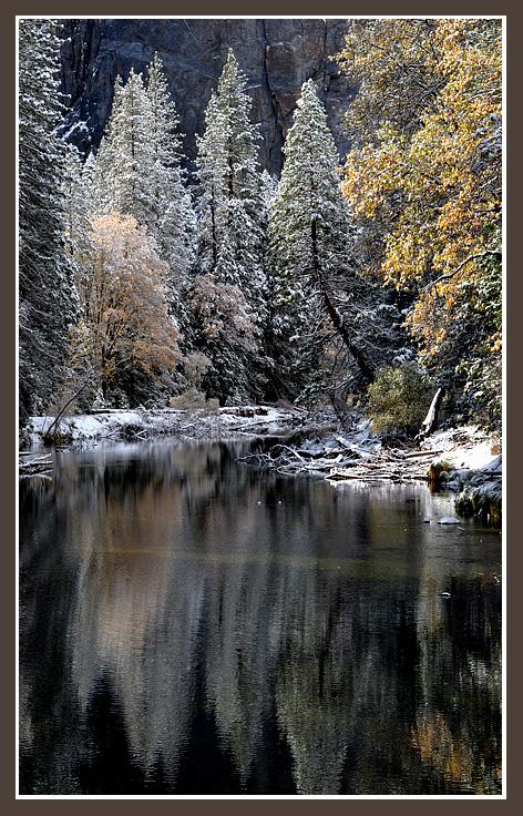 November 10, 2012An early season snow makes for a magical morning scene in Yosemite as fall colors are muted by winter white along the Merced River.