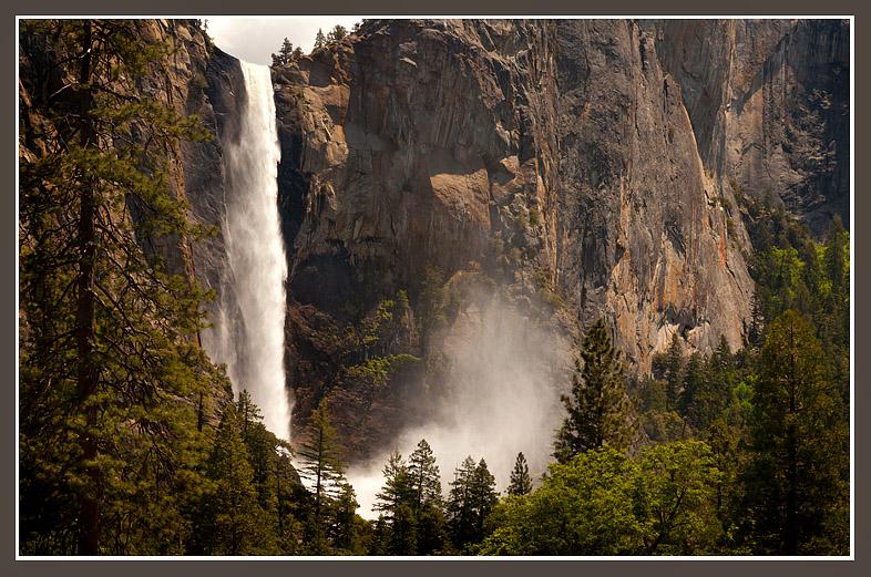 This year's exceptional snow pack drives Yosemite's Bridalveil Fall with a vengeance where the force of the water dropping more than 600' into the precipice generates a wind that creates the misty "bridal veil."