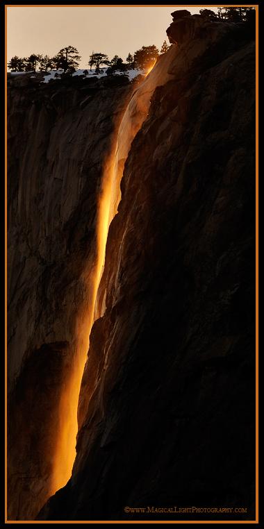 Warm sunlight bathes the wispy ephemera of Horsetail Fall in rich golden hues at sunset.