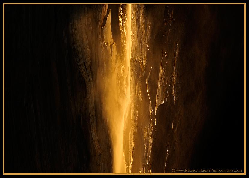Updrafts on Horsetail Fall create a misty veil of gold well out from the rock face of El Capitan.
